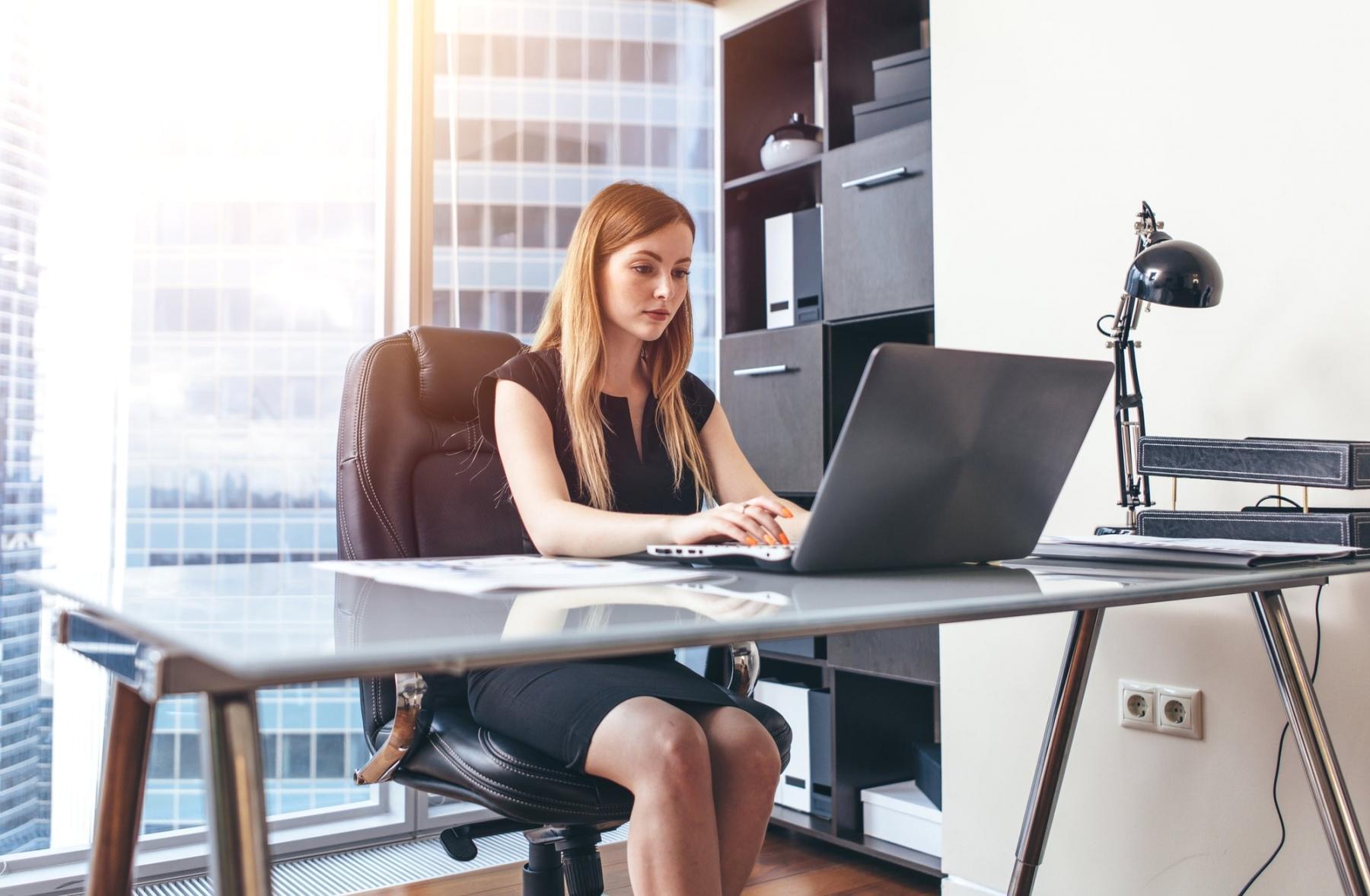 Financial analysis workspace with market data displays and investment research materials